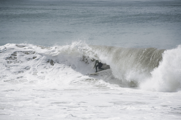 surfer riding big wave, Redondo Beach, CA
